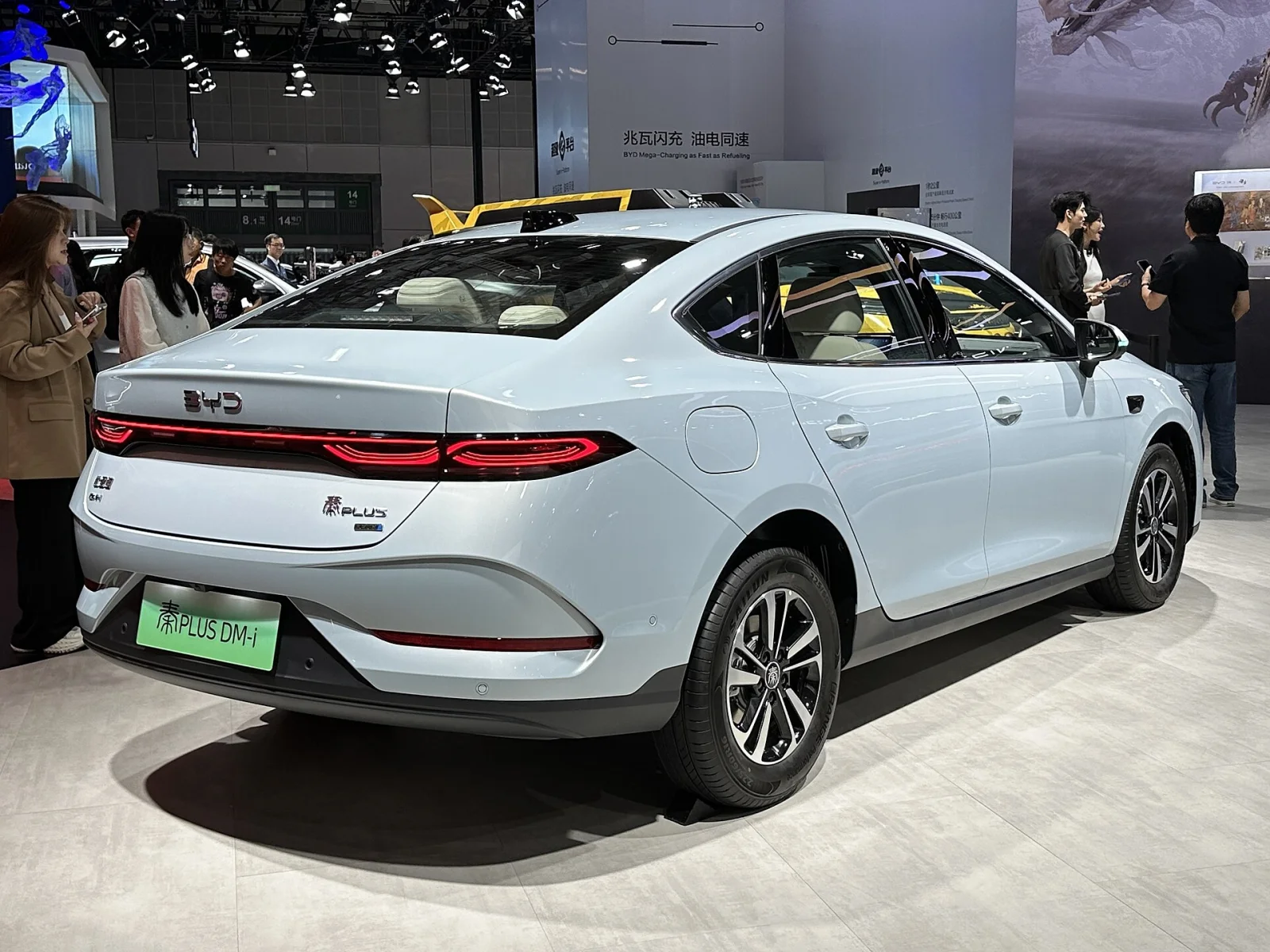 BYD Qin PLUS DM-i 2026 Model rear three-quarter view with full-width LED tail light bar